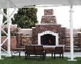 Lit Brick Fireplace in Courtyard
