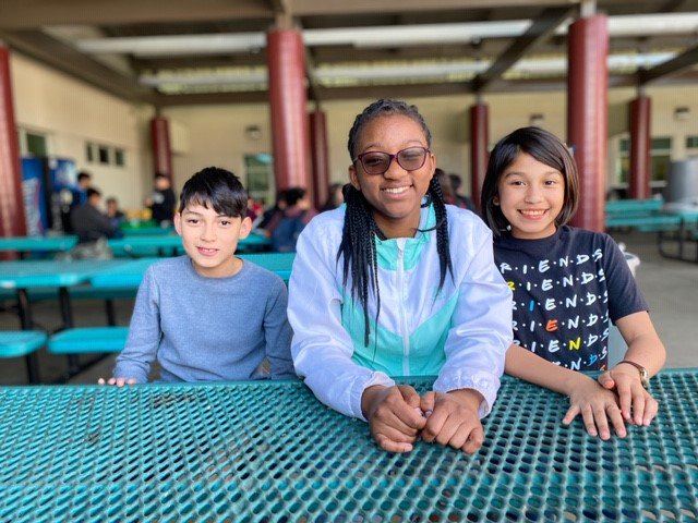 Three students posing for a picture 